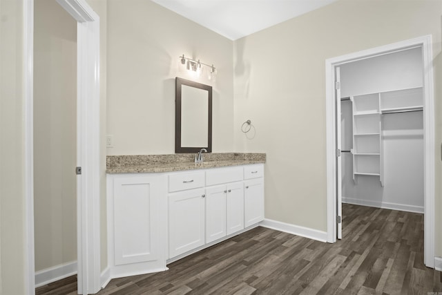 bathroom featuring hardwood / wood-style flooring and vanity