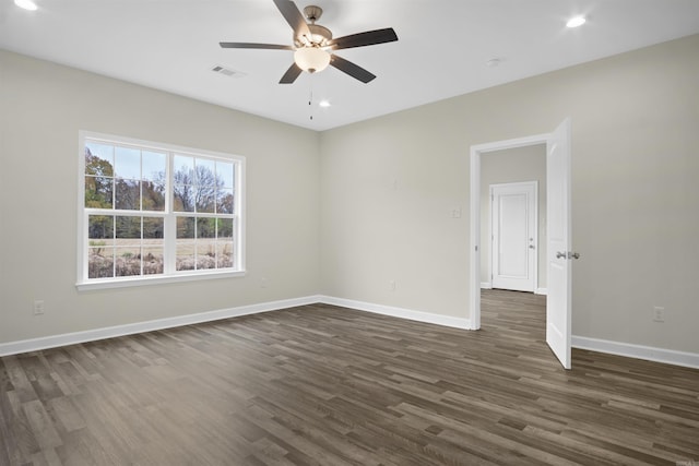 empty room featuring dark hardwood / wood-style floors and ceiling fan