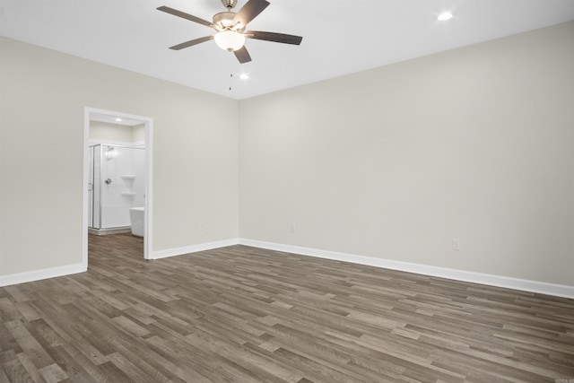 empty room featuring dark hardwood / wood-style floors and ceiling fan