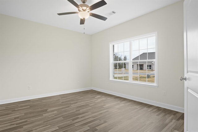 unfurnished room featuring ceiling fan and hardwood / wood-style floors