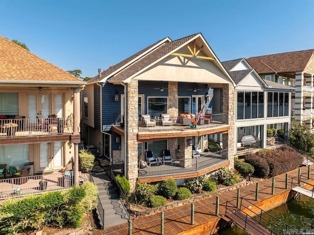 rear view of property featuring a patio and a balcony