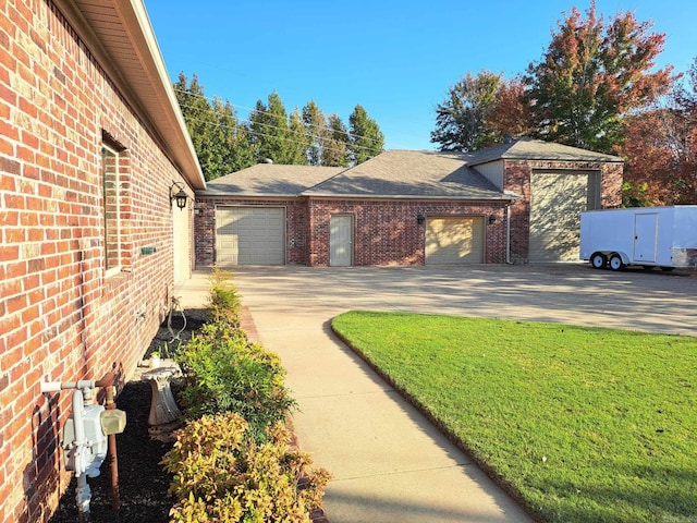 exterior space with a front lawn and a garage