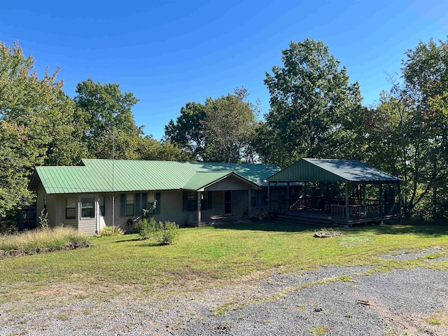 view of front of home featuring a gazebo and a front yard