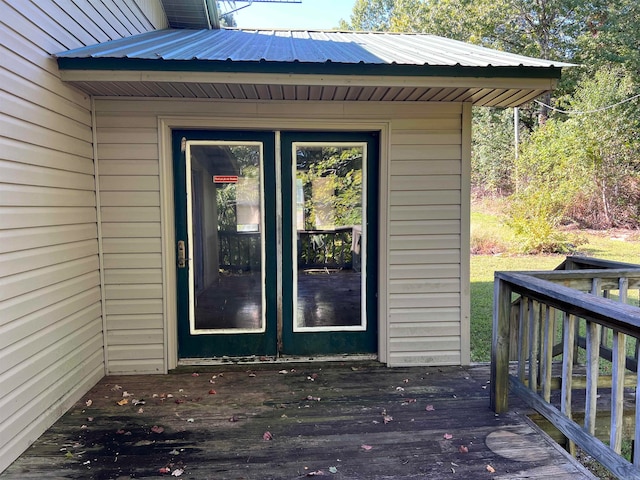 doorway to property featuring a wooden deck