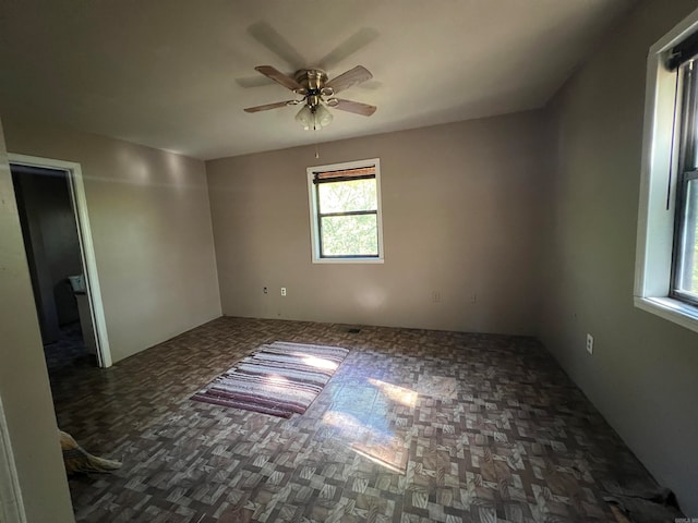 unfurnished room with ceiling fan