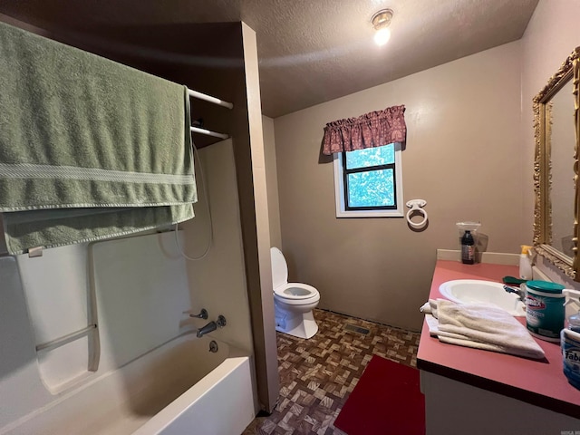 full bathroom featuring bathtub / shower combination, parquet flooring, a textured ceiling, toilet, and vanity