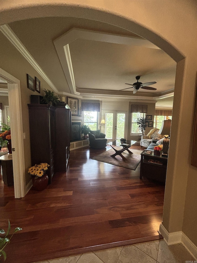 22 Alta Way, Hot Springs Village, AR 71909 - living room with crown molding, plenty of natural light, a tray ceiling, arched walkways, and a ceiling fan