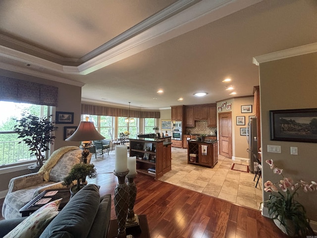 22 Alta Way, Hot Springs Village, AR 71909 - living room featuring crown molding, plenty of natural light, recessed lighting, light wood-style flooring, and baseboards