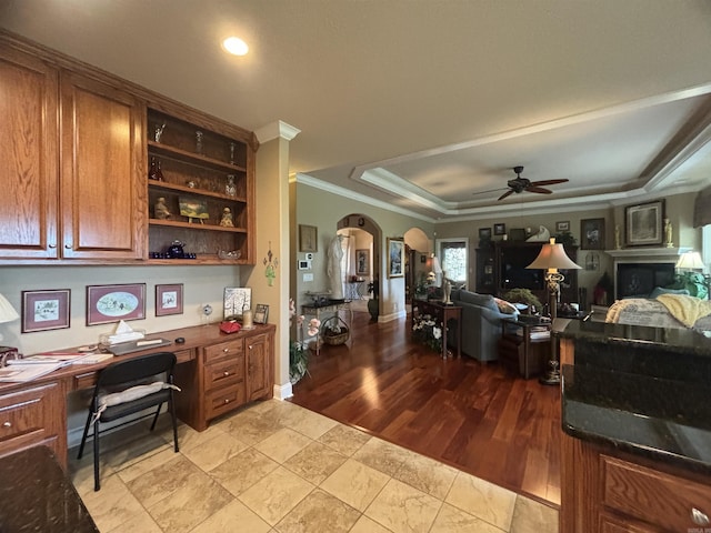 22 Alta Way, Hot Springs Village, AR 71909 - home office with crown molding, a ceiling fan, arched walkways, a raised ceiling, and built in desk