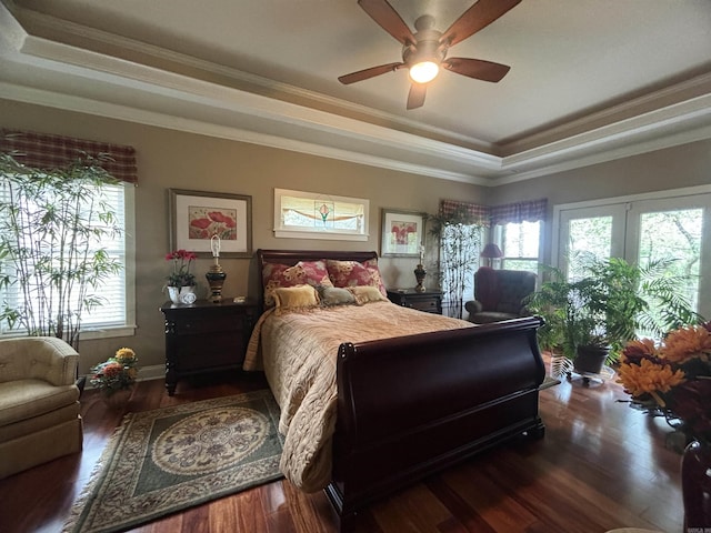 22 Alta Way, Hot Springs Village, AR 71909 - bedroom featuring a raised ceiling, crown molding, wood finished floors, ceiling fan, and french doors