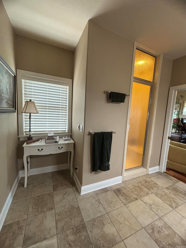 bathroom with a shower with shower door