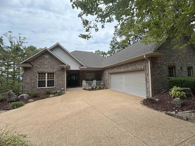 22 Alta Way, Hot Springs Village, AR 71909 - view of front facade with driveway, an attached garage, roof with shingles, and brick siding