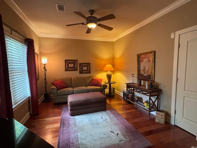 living room with ornamental molding, dark hardwood / wood-style flooring, and ceiling fan