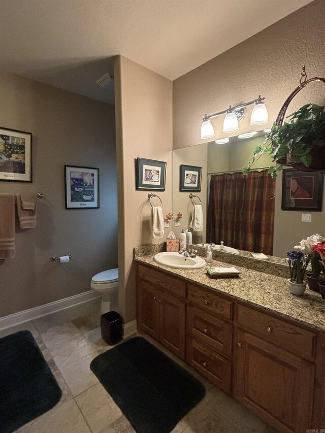22 Alta Way, Hot Springs Village, AR 71909 - bathroom with tile patterned flooring, toilet, and vanity
