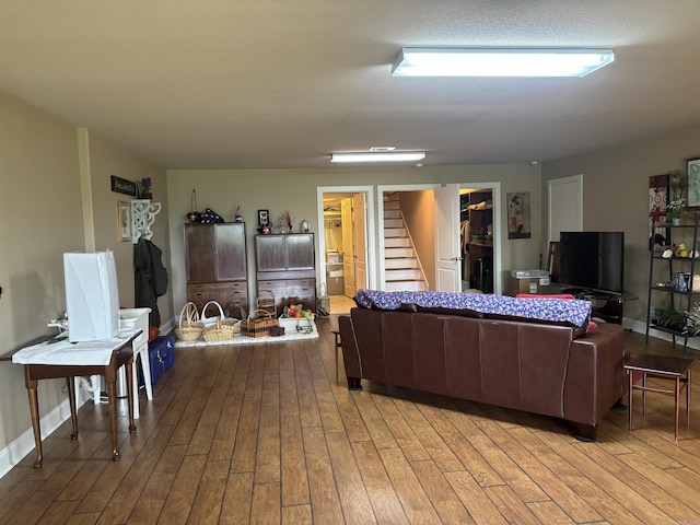 22 Alta Way, Hot Springs Village, AR 71909 - living area with stairway, wood-type flooring, and baseboards