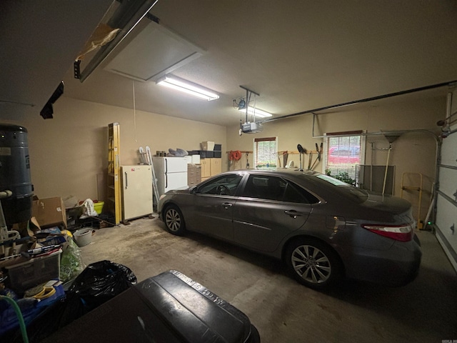 garage featuring a garage door opener and white fridge