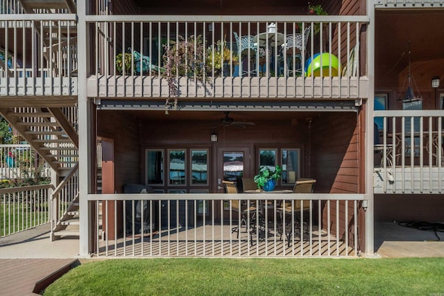 entrance to property featuring ceiling fan and a patio area