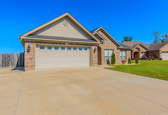 view of front of house featuring a front yard and a garage