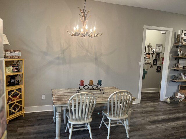 444 W Pleasant Springs Rd, Quitman, AR 72131 - dining area featuring baseboards, dark wood-style floors, and an inviting chandelier