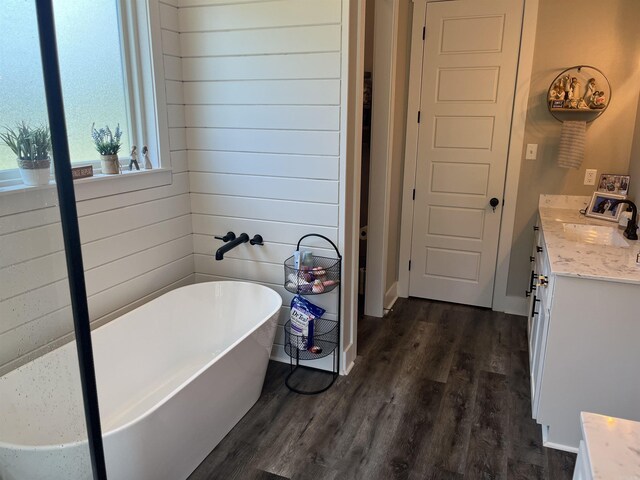 444 W Pleasant Springs Rd, Quitman, AR 72131 - full bathroom with a freestanding bath, vanity, and wood finished floors