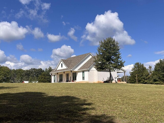 444 W Pleasant Springs Rd, Quitman, AR 72131 - view of front of property with stucco siding and a front lawn