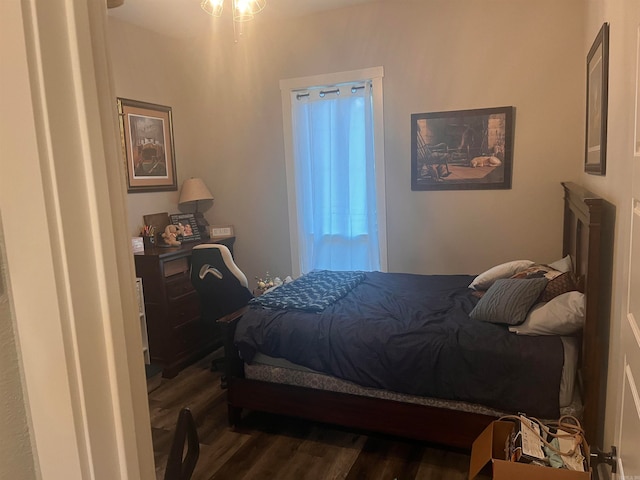 bedroom featuring dark hardwood / wood-style flooring