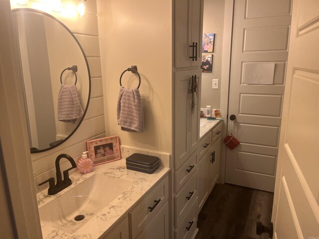 444 W Pleasant Springs Rd, Quitman, AR 72131 - bathroom featuring wood finished floors and vanity
