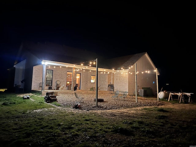 444 W Pleasant Springs Rd, Quitman, AR 72131 - back of house at night with brick siding and cooling unit