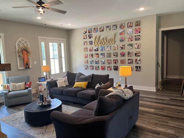 living room featuring ceiling fan and hardwood / wood-style floors