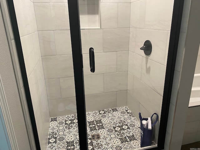 bathroom featuring an enclosed shower