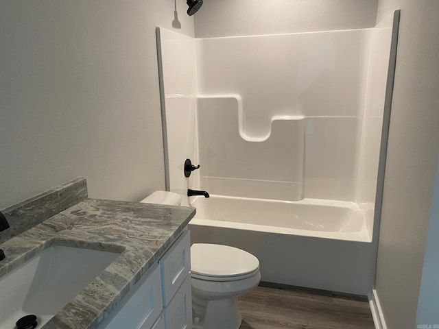 full bathroom featuring vanity, shower / bath combination, toilet, and hardwood / wood-style flooring