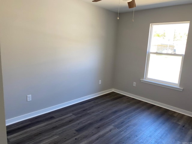 empty room featuring dark hardwood / wood-style floors and ceiling fan