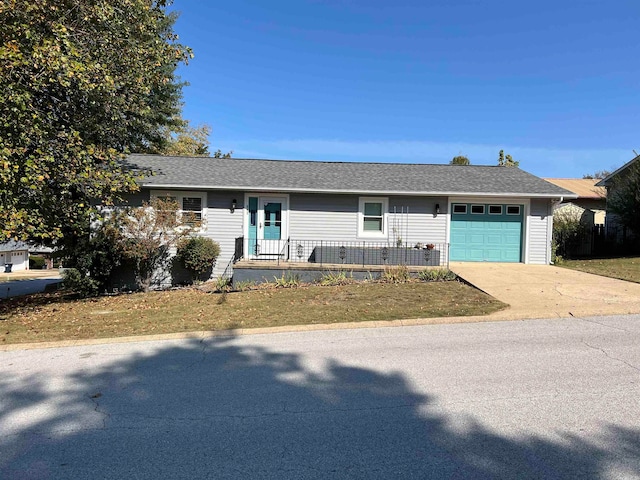 single story home with a front lawn and a garage