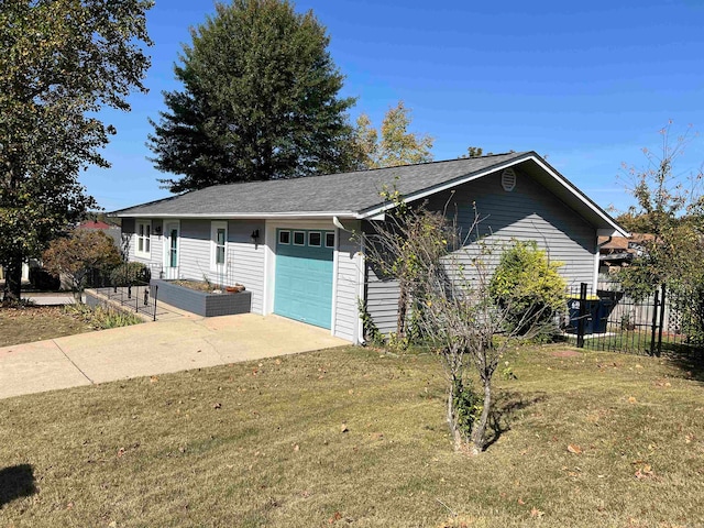 view of side of home featuring a yard and a garage