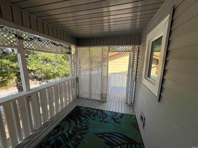 unfurnished sunroom featuring wood ceiling