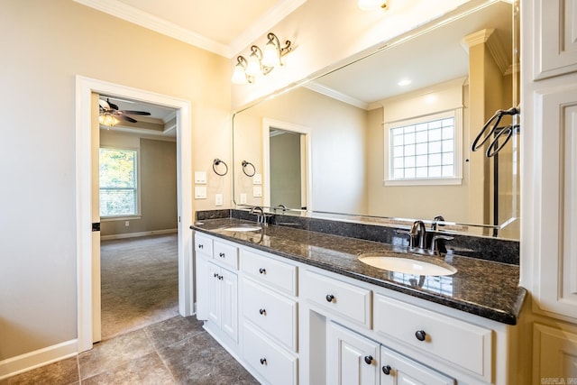 bathroom featuring crown molding, ceiling fan, and vanity