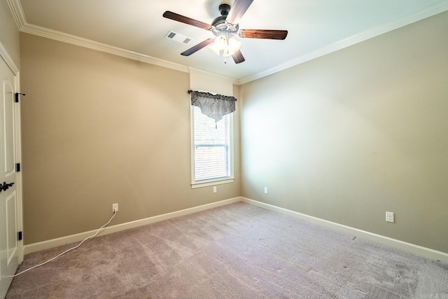 carpeted empty room with crown molding and ceiling fan