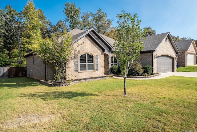 view of front of property with a garage and a front yard