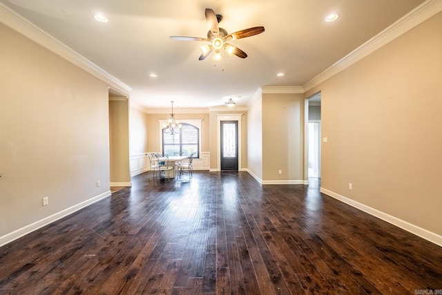 unfurnished living room featuring ornamental molding, dark hardwood / wood-style floors, and ceiling fan with notable chandelier