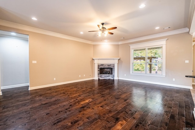 unfurnished living room featuring dark wood-type flooring, ornamental molding, and ceiling fan