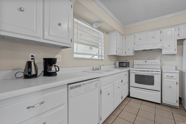 kitchen featuring white appliances, crown molding, sink, white cabinets, and a textured ceiling