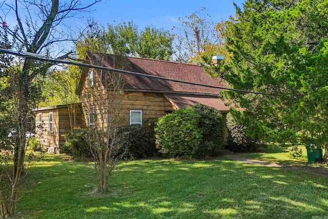 view of home's exterior featuring a yard