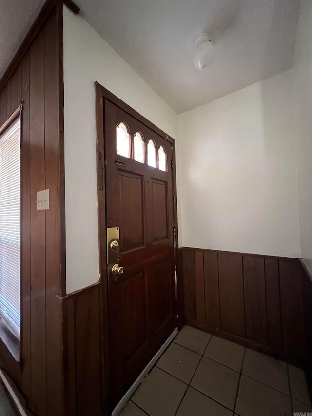 tiled entrance foyer with wooden walls