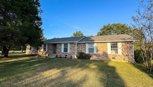 ranch-style home featuring a front yard