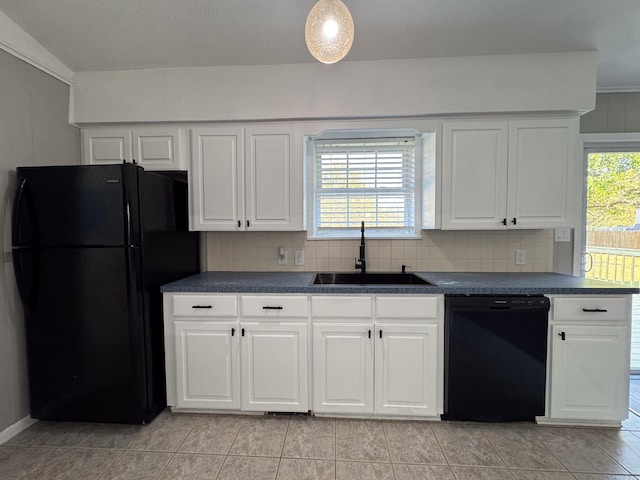 kitchen with black appliances, plenty of natural light, decorative backsplash, and white cabinetry