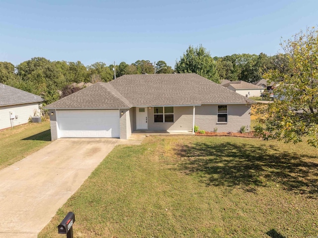 single story home featuring a front yard and a garage