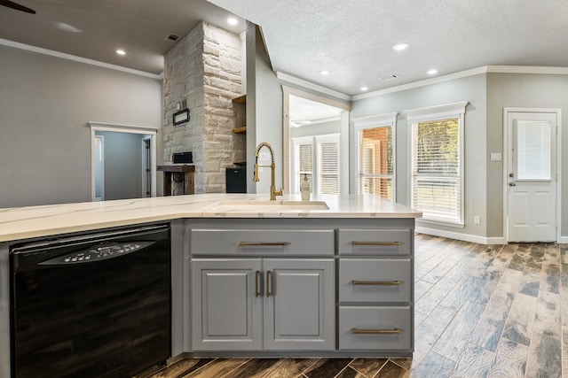 kitchen featuring dishwasher, gray cabinets, a textured ceiling, and dark wood-type flooring