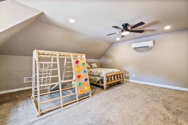 carpeted bedroom featuring ceiling fan, vaulted ceiling, and a wall mounted AC