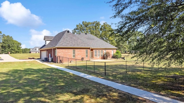 view of property exterior featuring a yard and a garage