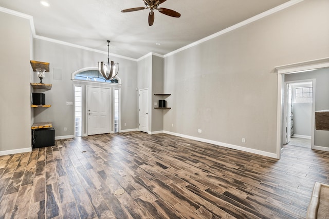 foyer entrance with ceiling fan with notable chandelier, crown molding, and dark wood-type flooring